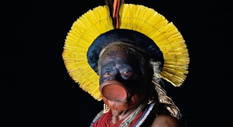 In this file photo taken on January 16, 2020 indigenous leader Raoni Metuktire of the Kayapo ethnicity poses for a photograph in Piaracu village, near Sao Jose do Xingu, Mato Grosso state, Brazil
