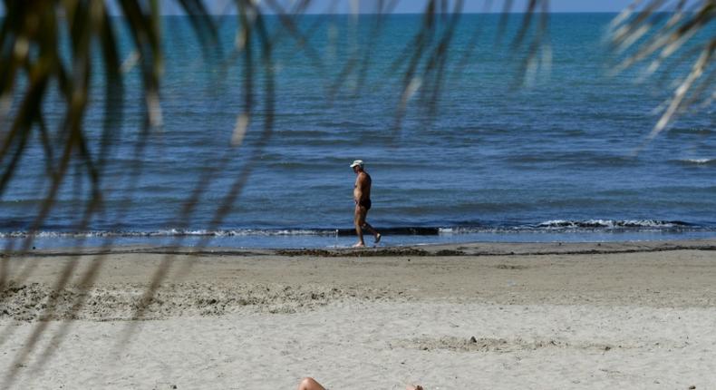 People sunbathe in Durres as Albania reopen beaches after weeks of lockdown