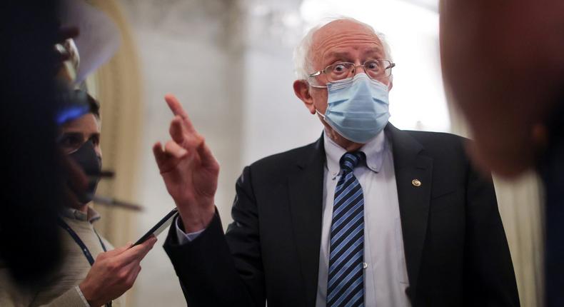 US Senator Bernie Sanders (I-VT) speaks with reporters about potential efforts to raise the minimum wage at the US Capitol in Washington, March 1, 2021.
