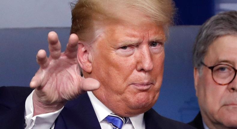 President Donald Trump talks during a briefing about the coronavirus in the James Brady Briefing Room, Monday, March 23, 2020, in Washington, as Attorney General William Barr looks on.