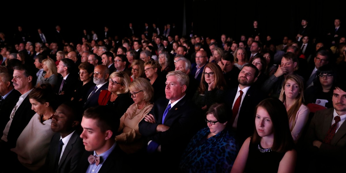 Members of the audience watch as Senator Tim Kaine and Governor Mike Pence debate.