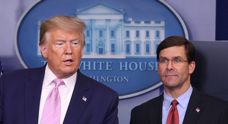 Former President Donald Trump speaks at the press briefing room as former Defense Secretary Mark Esper looks on at the White House on April 1, 2020.