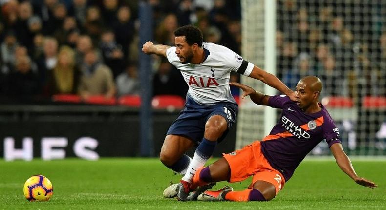 Tottenham's Belgian midfielder Mousa Dembele (left) is unlikely to feature again in 2018 due to ankle ligament damage