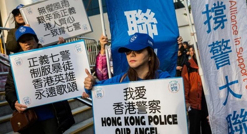 The trial of seven Hong Kong police officers attracted groups of pro- and anti-police demonstrators