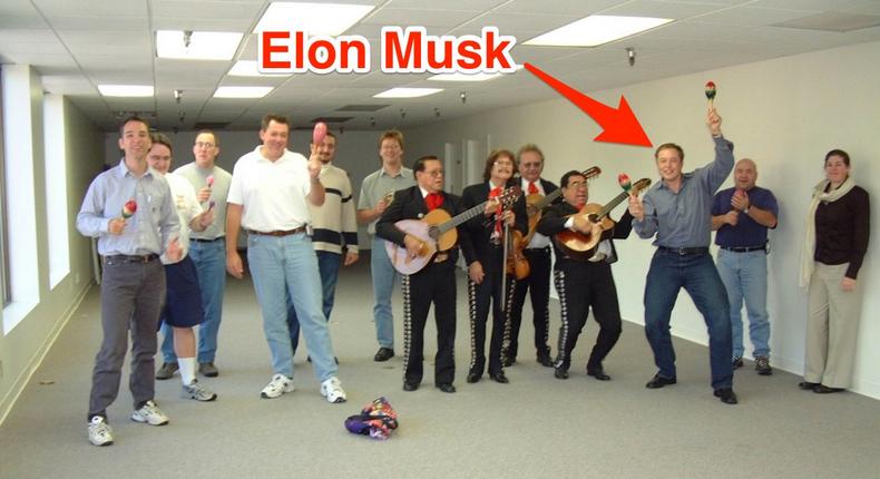 Elon Musk and the founding staff of SpaceX celebrate their first office space with a mariachi band in 2002.