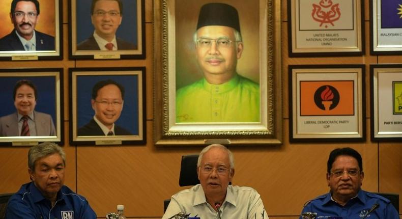 Malaysia's Prime Minister Najib Razak (C) speaks during a press conference in Kuala Lumpur on March 29, 2017