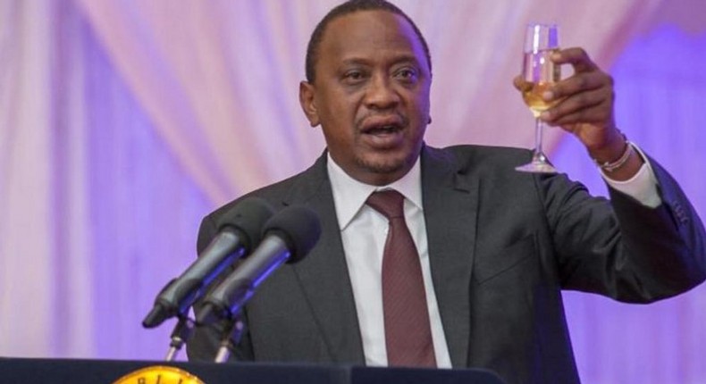 President Uhuru Kenyatta toasting to happy life at a past event.