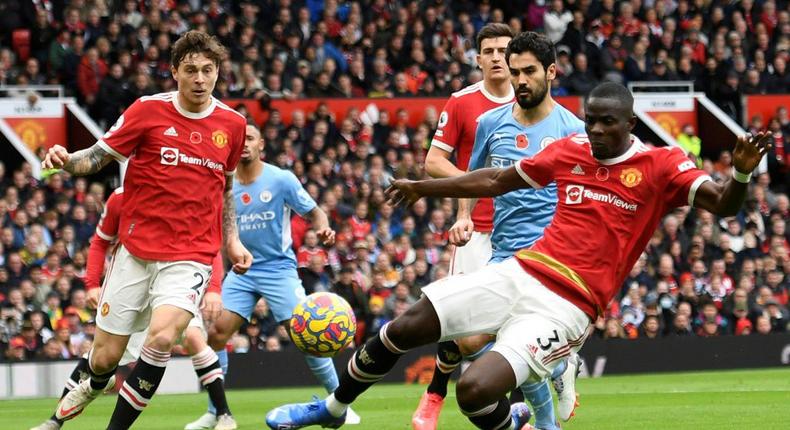 Manchester United centre-back Eric Bailly (R) concedes an own-goal against Manchester City at Old Trafford.