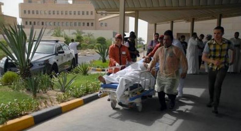A victim of a suicide bomb attack at Imam al-Sadeq Mosque arrives at the Amiri hospital in Al Sharq, Kuwait City, June 26, 2015.