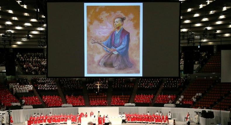 An illustration of Christian Samurai Takayama Ukon (1553-1615) -- as depicted by Japanese artist Kazuko Mimaki -- is projected onto a screen during a beatification ceremony in Osaka, on February 7, 2017