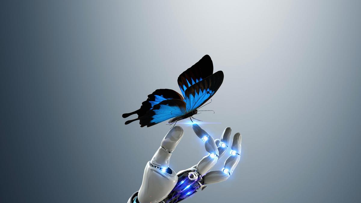 Robot hand holding butterfly