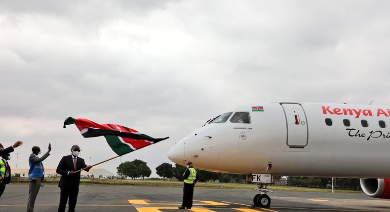 Transport CS James Macharia flags off a Kenya Airways plane during the resumption of local flights