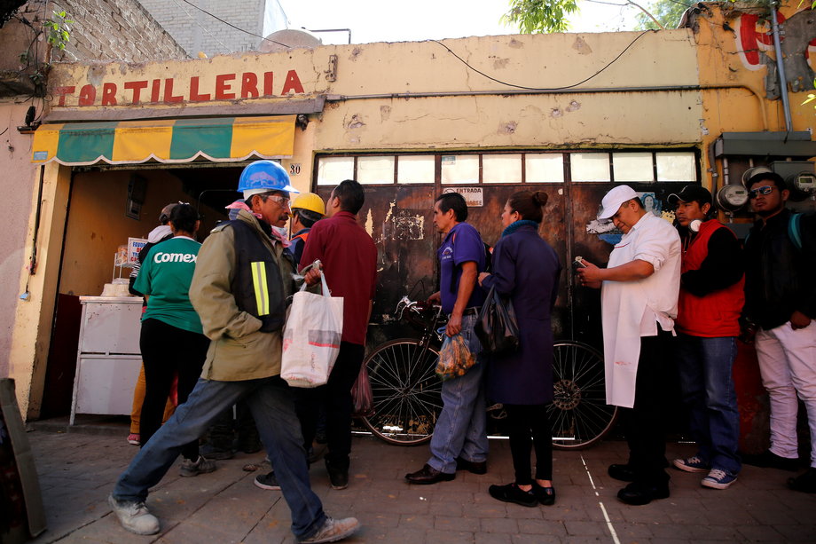 People queue to buy tortillas outside Granada market in Mexico City, Mexico, January 10, 2017.