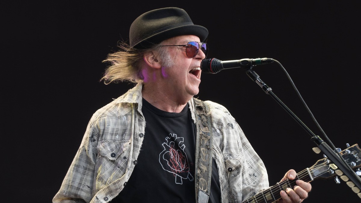 Neil Young performing live on stage in Hyde Park in London