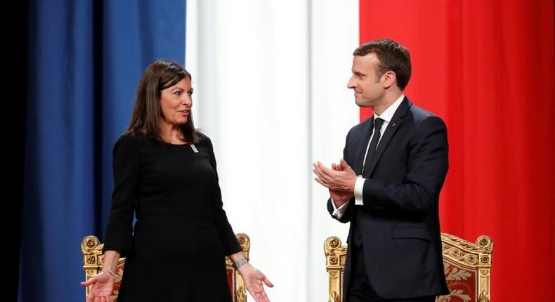 French President Emmanuel Macron (R) told Paris' Mayor Anne Hidalgo, I'm right with you on your venture for the Olympics, Paralympics and the 2024 objective