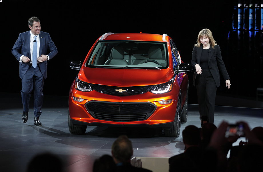 Mary Barra, Chairman and CEO of General Motors, and Mark Reuss, Executive Vice President of GM Global Product Development, reveal the Chevrolet Bolt EV to the news media at the 2016 North American International Auto Show January 11th, 2016 in Detroit, Michigan.
