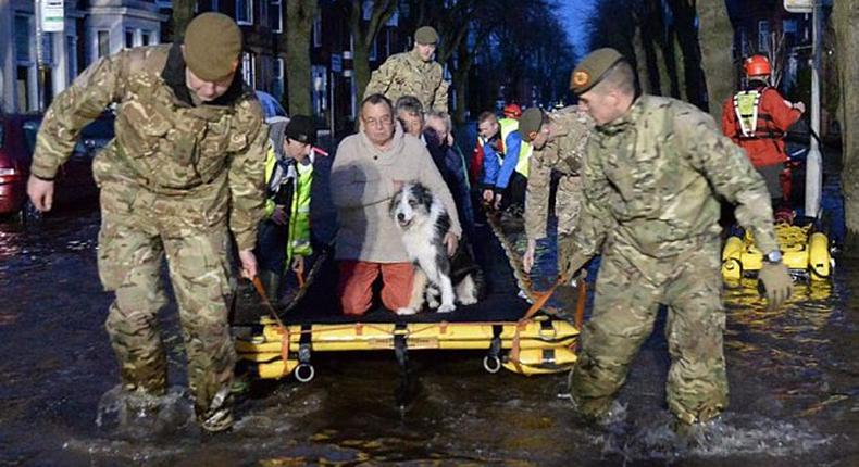 British PM Cameron chairs emergency meeting as thousands affected by floods