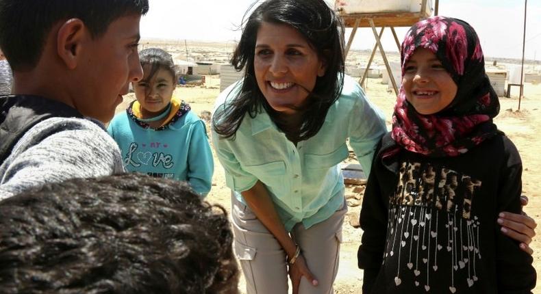 US Ambassador to the UN Nikki Haley talks to Syrian refugees during a visit to the Zaatari refugee camp on the Jordanian border with Syria on May 21, 2017