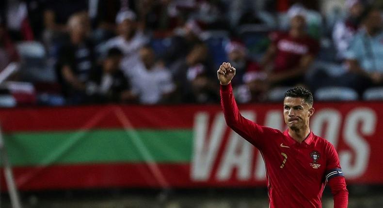 On target: Cristiano Ronaldo celebrates after scoring against Qatar Creator: CARLOS COSTA