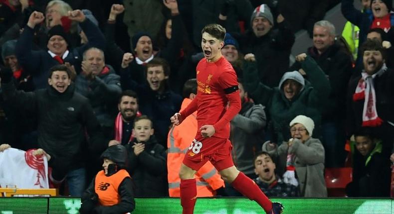 Liverpool's Welsh striker Ben Woodburn celebrates scoring a goal during the EFL Cup quarter-final match against Leeds United at Anfield in Liverpool on November 29, 2016