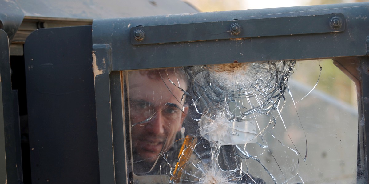 A member of the Iraqi rapid-response forces sits in a military vehicle during battle with ISIS militants in the Mithaq district of eastern Mosul, Iraq, January 5, 2017.