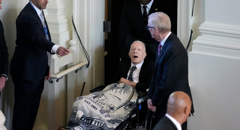 Former President Jimmy Carter, arrives to attend a tribute service for his wife and former first lady Rosalynn Carter, at Glenn Memorial Church, Tuesday, Nov. 28, 2023, in Atlanta.Andrew Harnik/AP