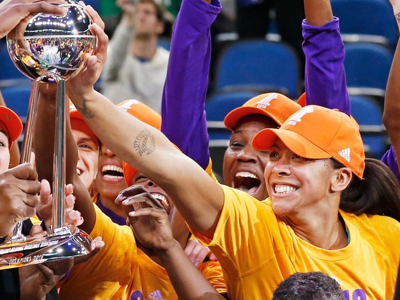 Parker (right) celebrates her first WNBA championship with the Los Angeles Sparks.AP Photo/Jim Mone