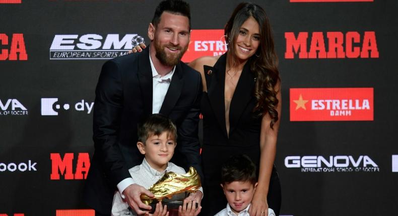 Barcelona's Argentinian forward Lionel Messi (L) poses with his wife Antonella Roccuzzo and his sons Thiago and Mateo after receiving his sixth Golden Shoe award after receiving the 2019 European Golden Shoe honoring the year's leading goalscorer during a ceremony at the Antigua Fabrica Estrella Damm in Barcelona on October 16, 2019.