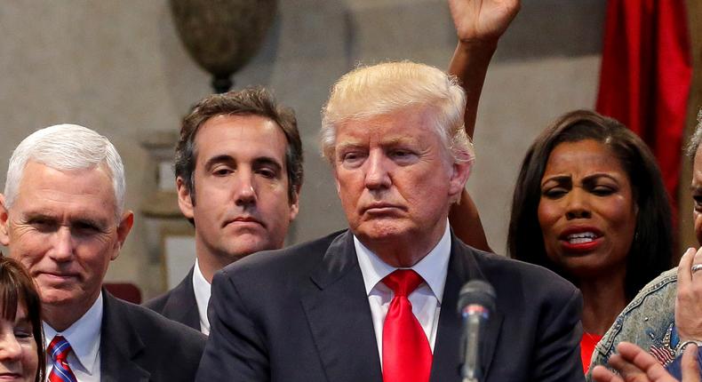 Michael Cohen, second from left, and Donald Trump.