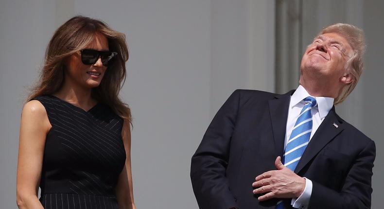 Donald Trump eventually donned eclipse glasses, but he couldn't resist sneaking a look with his naked eyes.