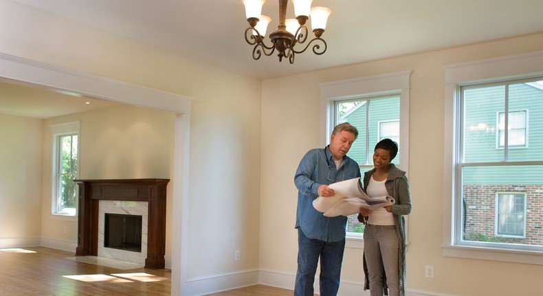 Home inspector and prospective home buyer.David Sacks/Getty Images