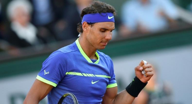 Spain's Rafael Nadal celebrates after winning against Austria's Dominic Thiem their semifinal tennis match at the Roland Garros 2017 French Open on June 9, 2017 in Paris