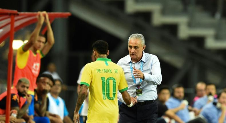Neymar limps off after just 12 minutes of Brazil's 1-1 draw with Nigeria in Singapore