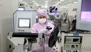 A woman works at a semiconductor plant in Yangxin county in east China's Shandong province.Feature China/Getty Images