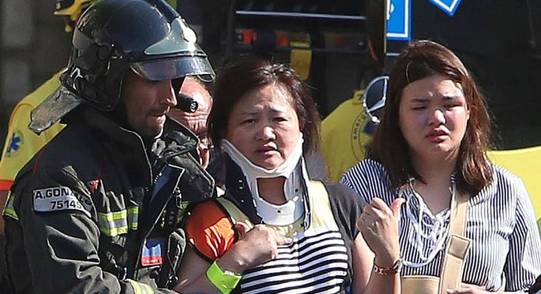 Injured people are treated in Barcelona, Spain, Thursday, Aug. 17, 2017 after a white van jumped the sidewalk in the historic Las Ramblas district, crashing into a summer crowd of residents and tourists and injuring several people, police said.