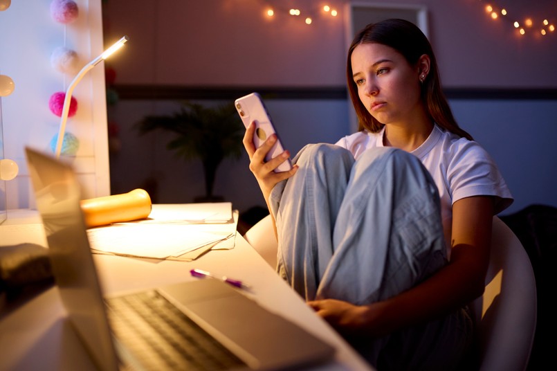 Worried,Teenage,Girl,Sitting,At,Desk,In,Bedroom,At,Home