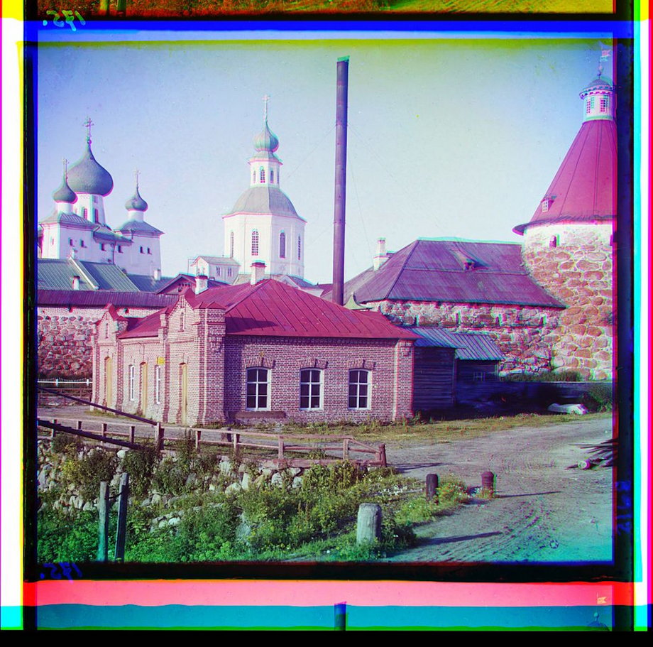 A side view of Trinity Cathedral and the electric station at the Solovetskii Monastery, Solovetski Islands.