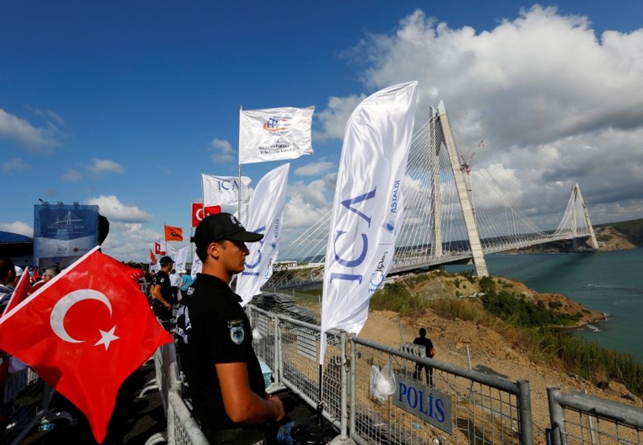 A riot police stands guard during the opening ceremony of newly built Yavuz Sultan Selim bridge, the third bridge over the Bosphorus linking the city's European and Asian sides in Istanbul