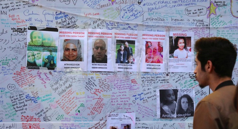 A man looks at a message wall near the scene of the fire which destroyed the Grenfell Tower block, in north Kensington, west London, Britain June 15, 2017.