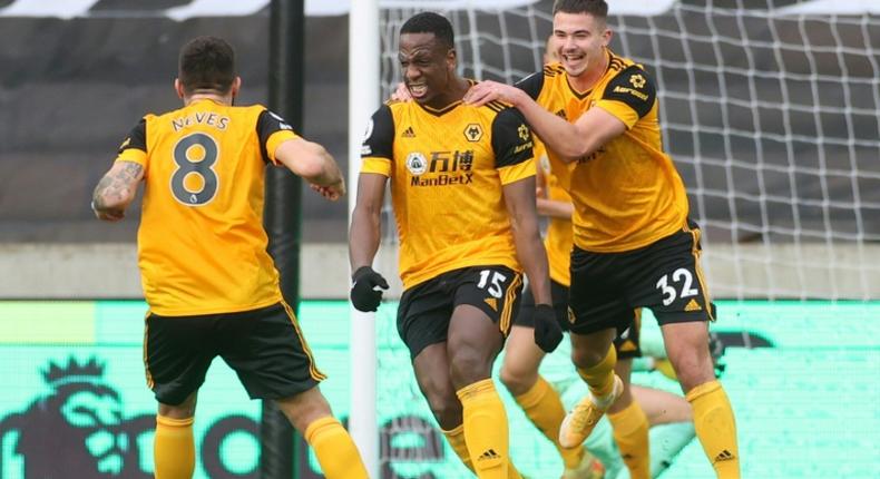 Ivory Coast international Willy Boly (C) celebrates scoring for Wolves against West Bromwich in the English Premier League.