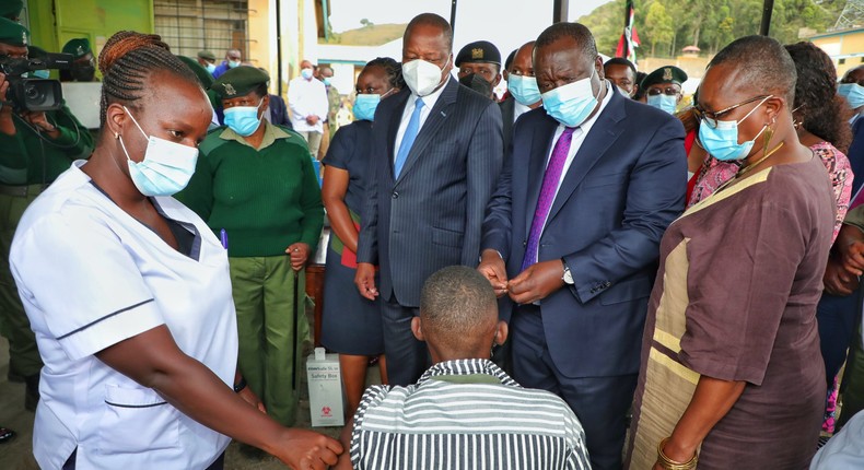 Interior CS Fred Matiang'i and Health CS Mutahi Kagwe during a vaccination exercise at a Kenyan prison