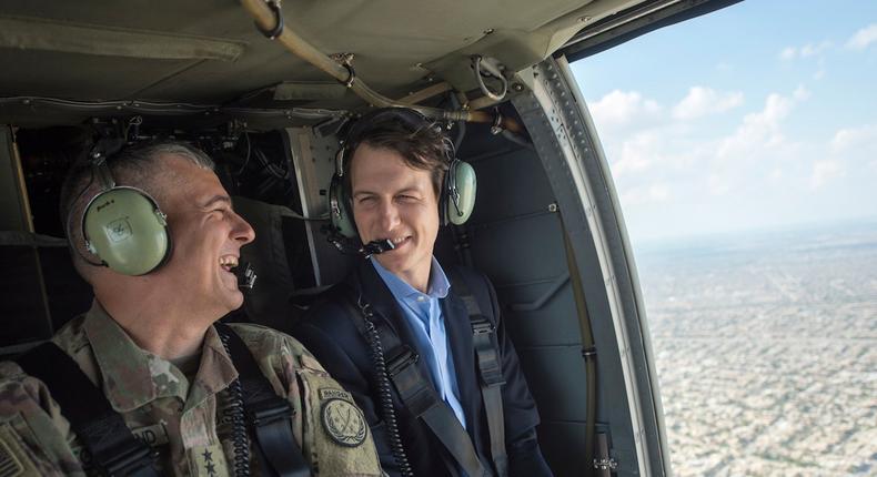 Kushner and Lt. Gen. Stephen J. Townsend share a laugh in a helicopter above Baghdad.