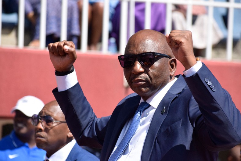 Lesotho Prime Minister Sam Ntsokoane Matekane raises his fists in celebrations as he arrives at his inauguration at Setsoto stadium in Maseru on October 28, 2022. [Photo by MOLISE MOLISE/AFP via Getty Images]