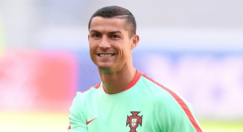 Portugal's Cristiano Ronaldo smiles during a training session on the eve of the Confederations Cup match against Mexico in the Russian city of Kazan