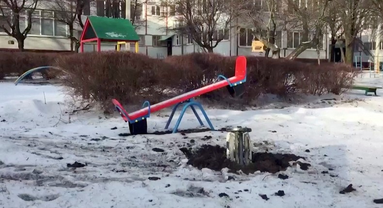 An unexploded Grad rocket is seen at a kindergarten playground in Kharkiv, Ukraine, February 26, 2022, in this still image obtained from a video