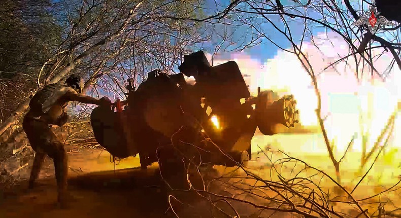 A Russian soldier fires a gun toward a Ukrainian position in Russia's Kursk region in an image from video released by the Russian Defense Ministry in October 2024.Russian Defense Ministry Press Service photo via AP, File