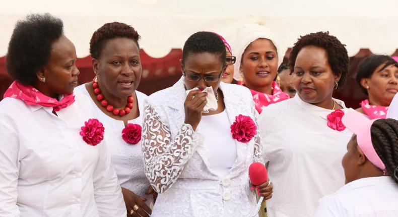 Sabina Chege is comforted by other women leaders after breaking into tears