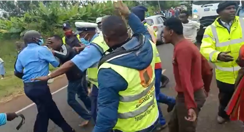 File image of traffic police officers during an attack by Kirinyaga County residents