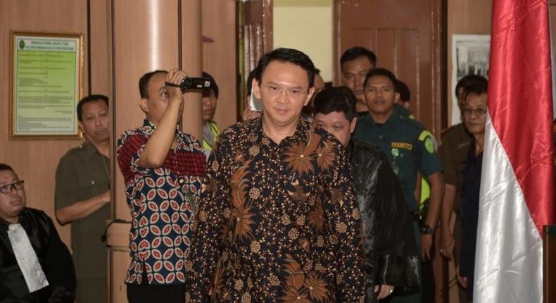 Jakarta's Christian governor Basuki Tjahaja Purnama (C) is on trial for blasphemy and faces a five-year prison sentence if convicted