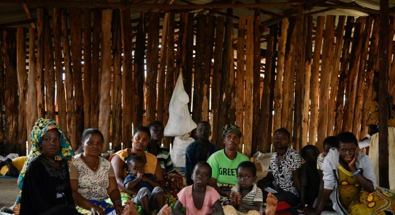 The UN says there are about 25 million refugees globally -- here, a refugee family from the Democratic Republic of Congo (DRC) wait in a makeshift shelter before their registration at a settlement in western Uganda